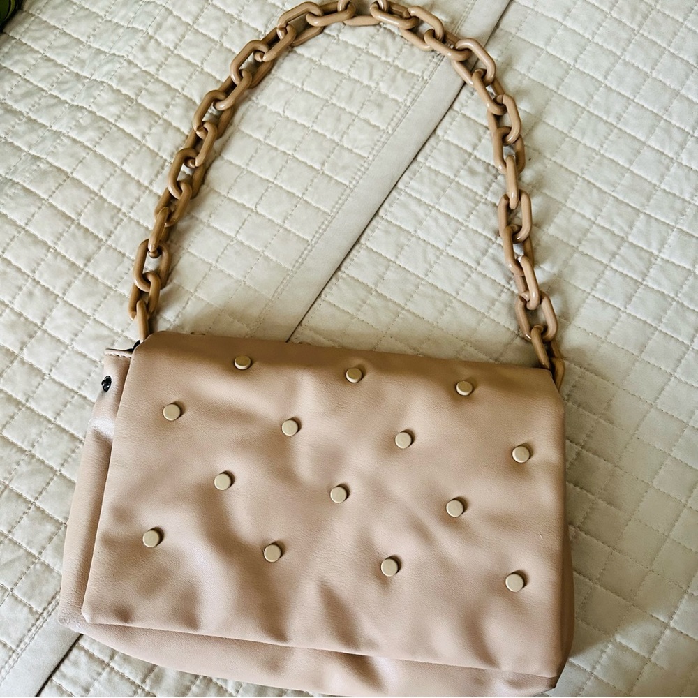 Faux leather purse in beautiful tan color w/ tan colored studs & chain handle.